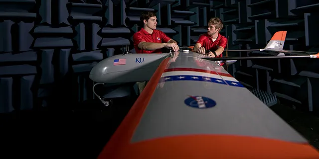 Doctorate of aerospace education students in KU simulating flight dynamics in an aerospace engineering research lab