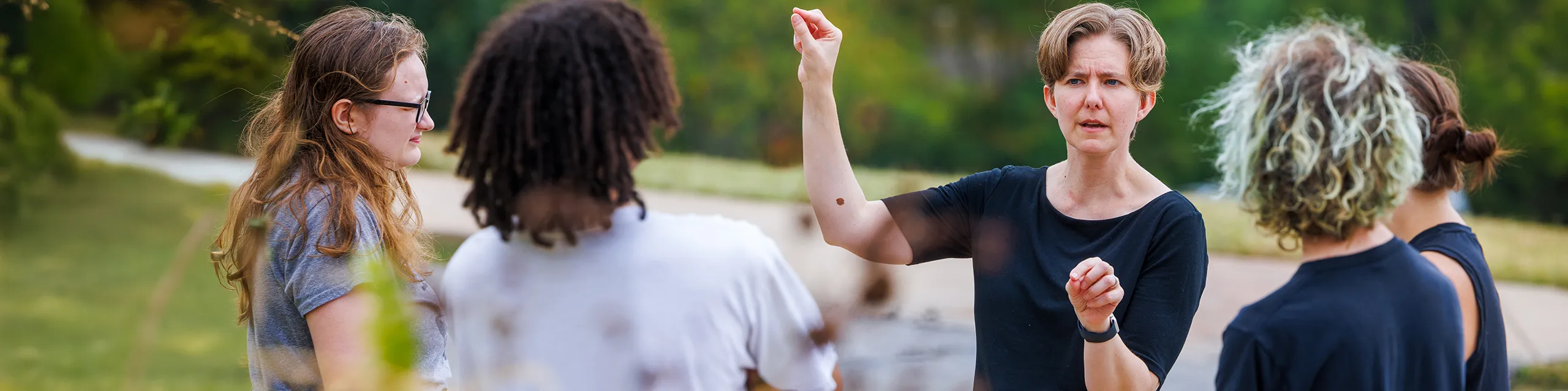 Faculty member working with american sign language degree students