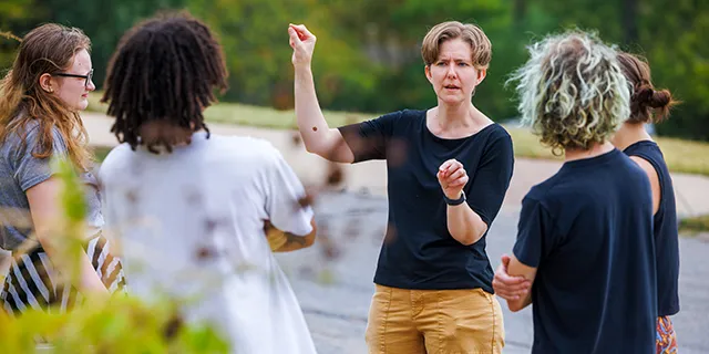 Faculty member working with american sign language degree students