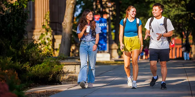 Astronomy degree students walking through KU's Lawrence campus