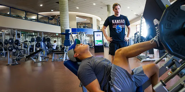 Athletic training masters students practicing proper form in the KU gym