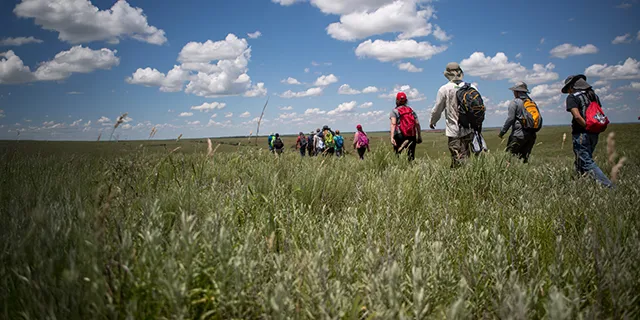 Doctorate of atmospheric science students at KU conducting research inthe field