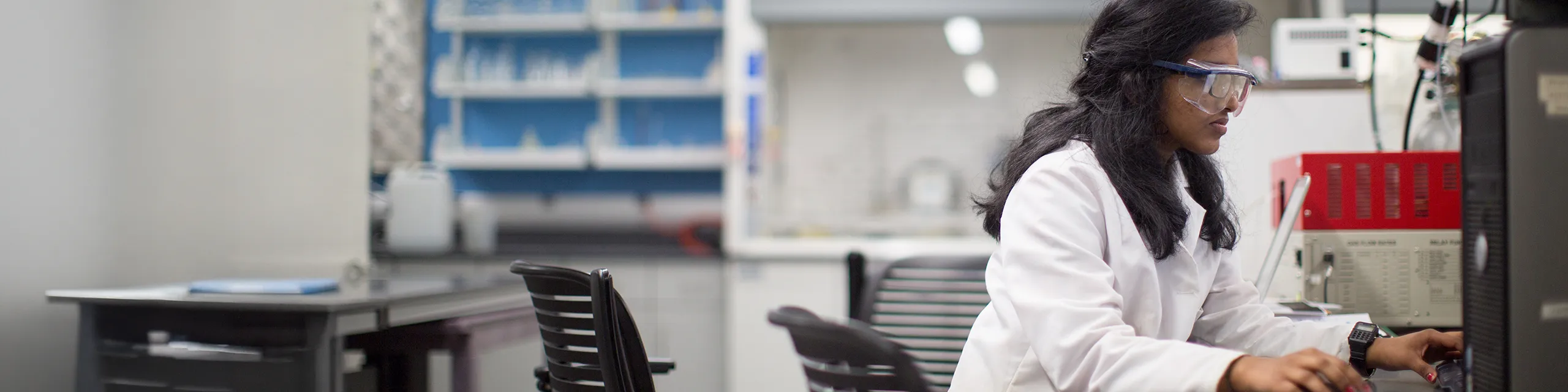 Biochemistry and molecular biology masters student running DNA gel electrophoresis in a university of Kansas molecular biology lab