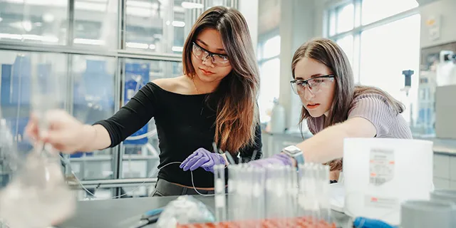 Master of chemical engineering students simulating reactor processes in a university of Kansas lab