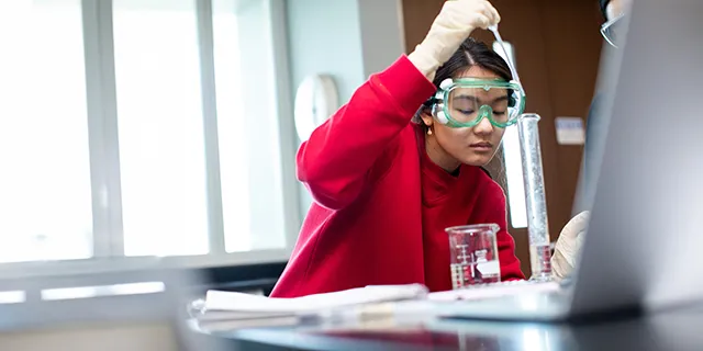 Doctor of chemistry student in KU working in a chemistry research lab