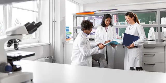 Doctor of clinical laboratory science students in KU analyzing blood samples in a clinical laboratory science lab