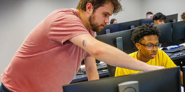 Students discussing communication studies research in class