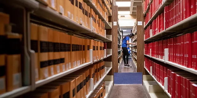 Communication studies doctorate students in KU analyzing rhetorical texts in a communication studies research lab
