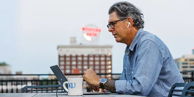 Dcotor of computer science student at KU optimizing AI algorithms working remotely
