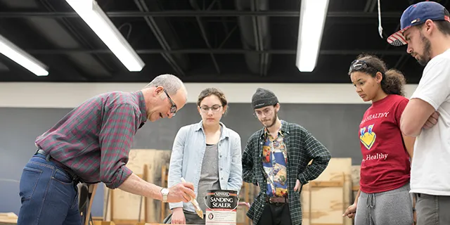 Masters of construction management students watching a demonstration from KU faculty