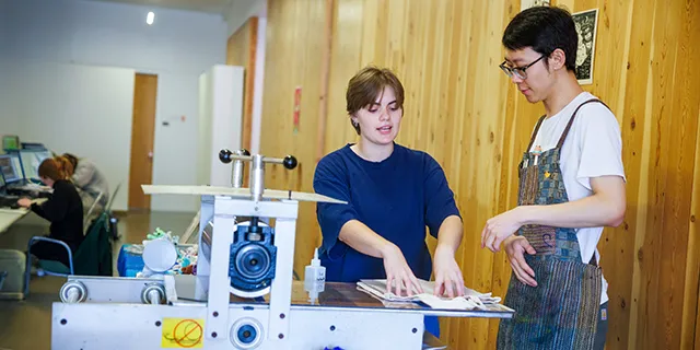 University of Kansas design degree student working with KU faculty in design studio