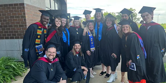 Mater of digital and integrated marketing and communications graduates posing for a photo