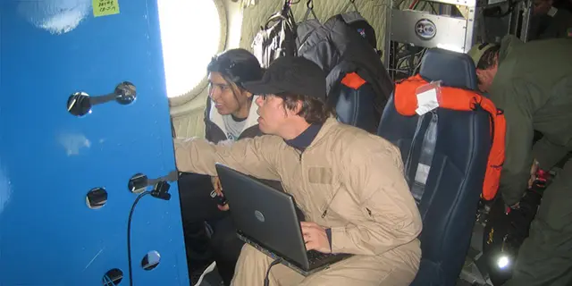 Master of electrical engineering and computer science students coding AI algorithms