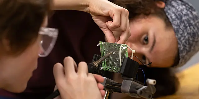 University of Kansas electrical engineering degree students working in electrical engineering circuit lab