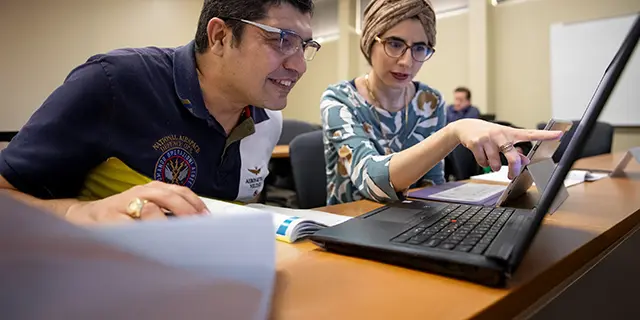 Masters of engineering management students collaborating on a studio project
