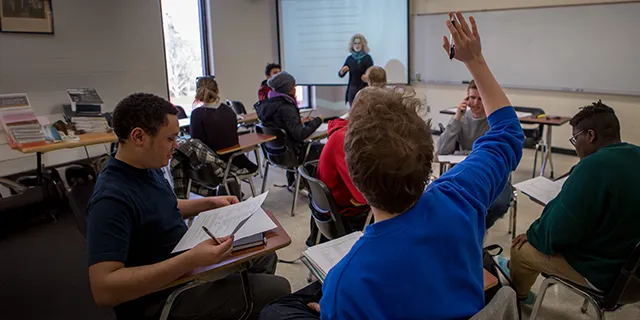 Master of english students discussing classic literature in the University of Kansas seminar room