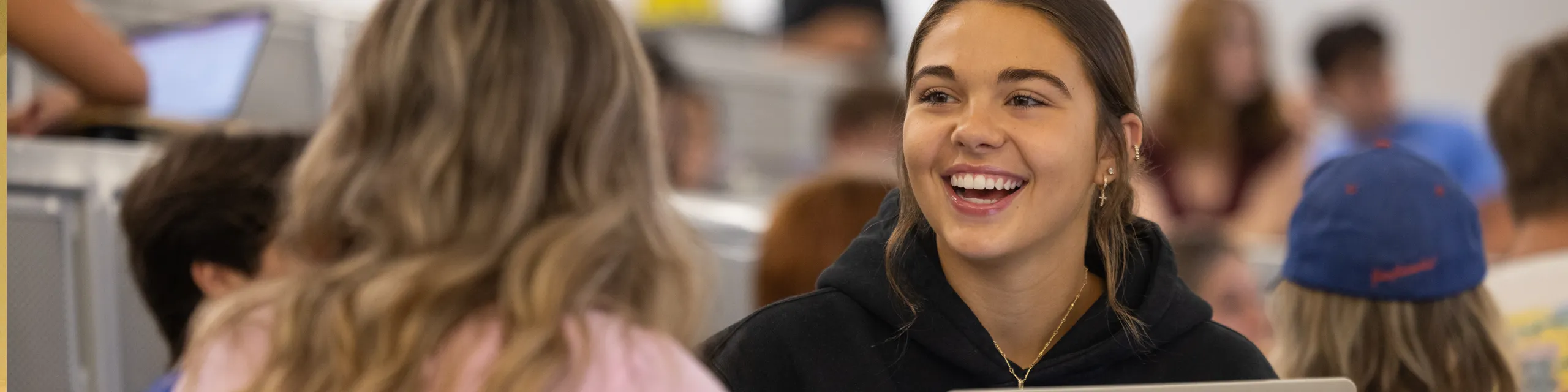 KU students participate in classroom discussion and academic collaboration as part of a master's in English program.