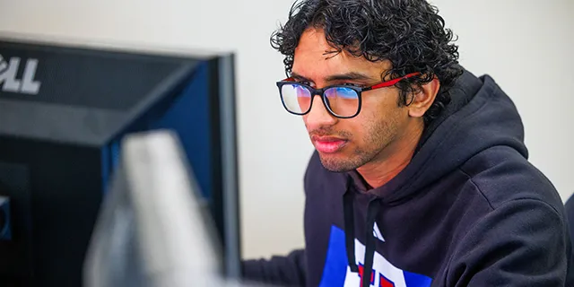 Information technology degree student studies in one of KU's innovative labs