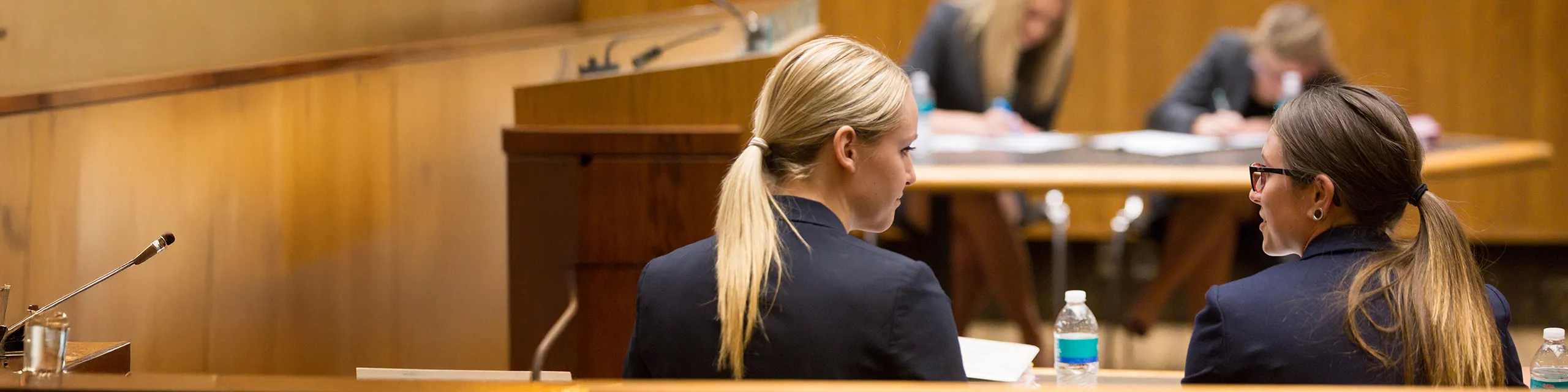 Juris doctor students in KU arguing a mock trial in a law school courtroom