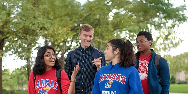 Doctor of mathematics students walking through the University of Kansas campus