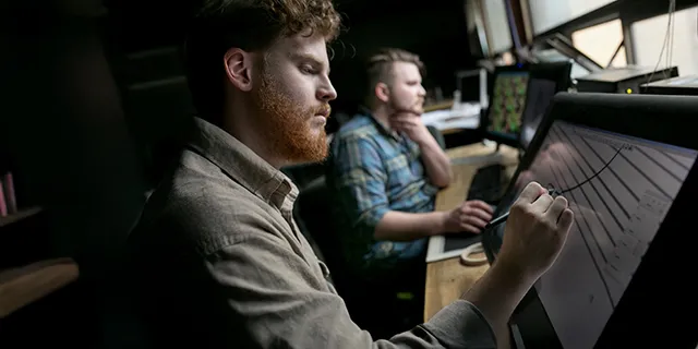 University of Kansas mechanical engineering degree students designing in mechanical engineering workshop