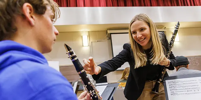 Doctor of Musical Arts students rehearsing in a university of Kansas ensemble hall with instruments