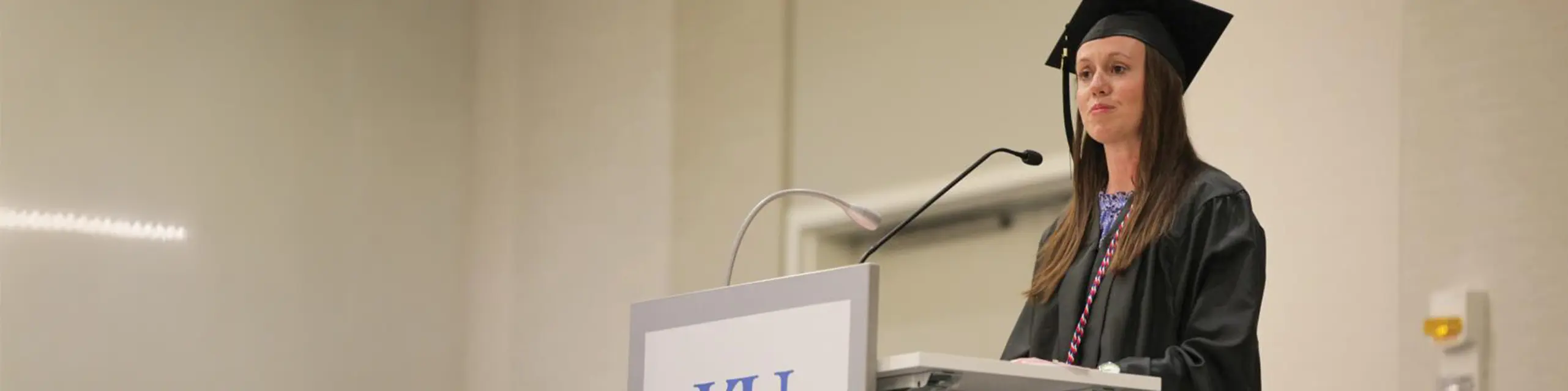 Master of organizational leadership student at KU speaking at commencement