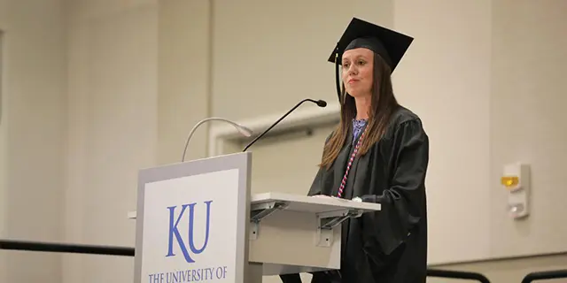 Master of organizational leadership student at KU speaking at commencement