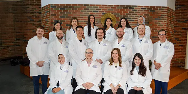 Doctor of pathology students at KU celebrating the white coat ceremony
