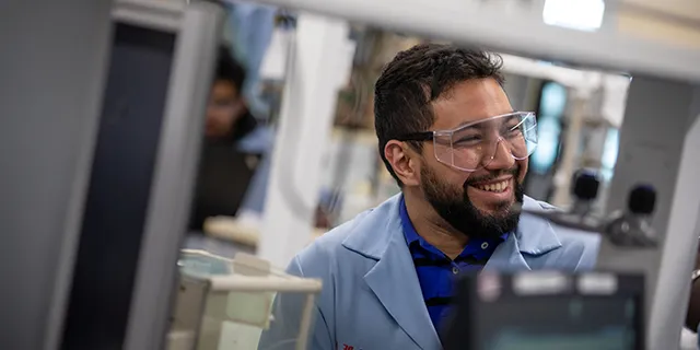 Master of pathology students in KU examining tissue slides under microscopes in a pathology lab