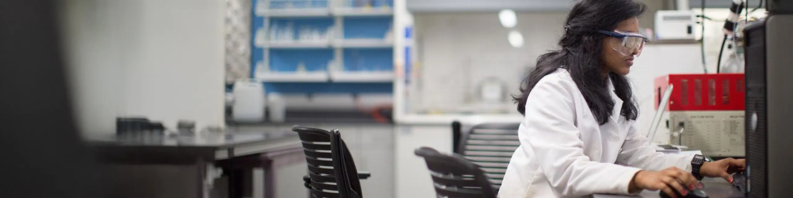 Doctor of pharmacology and toxicology student at KU conducting toxicity assays in a pharmacology and toxicology lab