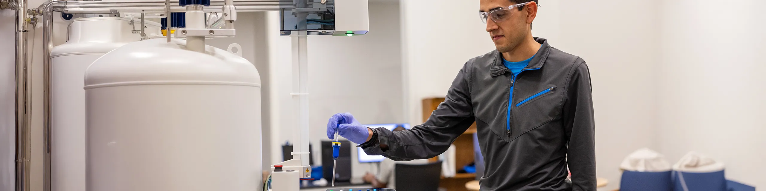 Master in pharmacology and toxicology student at KU conducting toxicity assays in a pharmacology and toxicology lab