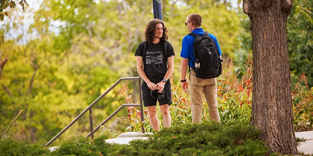 KU philosophy degree students discussing philosophy, logic, and ethics on campus