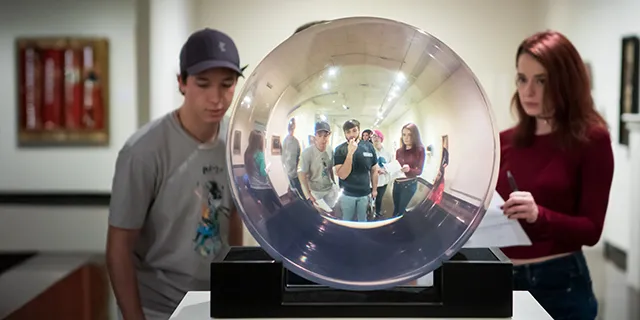 University of Kansas physics degree students conducting experiments in physics lab