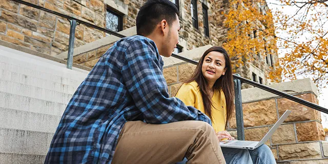 University of Kansas psychology degree students chatting on campus