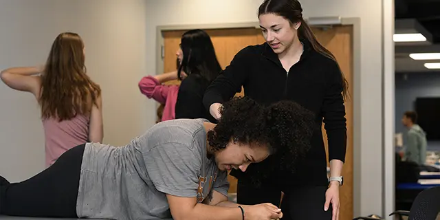 Doctor of rehabilitation science students at KU analyzing gait patterns in a rehabilitation science lab