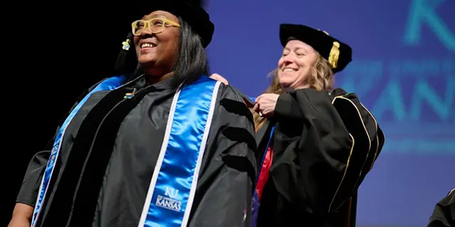 Social work PhD student at graduation ceremony