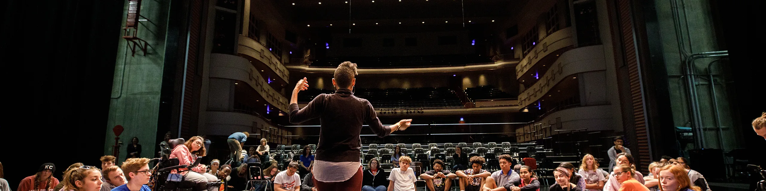 KU students participate in a stage rehearsal inside at the Lied Center of Kansas, gaining practical experience in acting, performance, and production as part of the musical theatre degree.