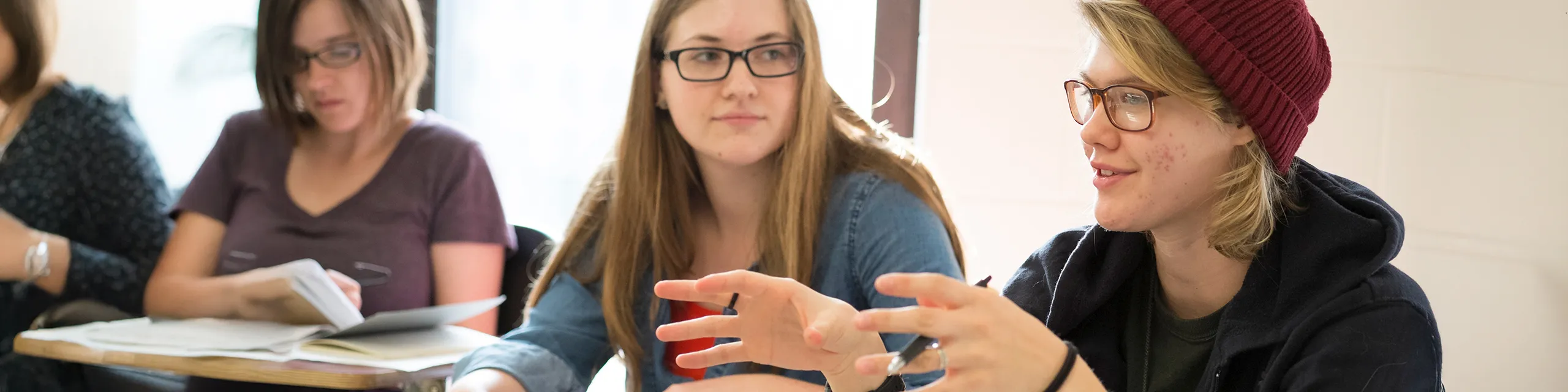 Women, gender and sexuality studies degree students having a conversation in class