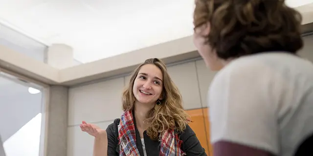 Master of women, gender and sexuality studies students discussing feminist theory and gender issues in a university of Kansas seminar room